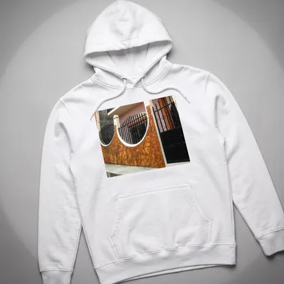 Photographic print of a Guatemalan home exterior in warm colors — printed on a unisex hoodie