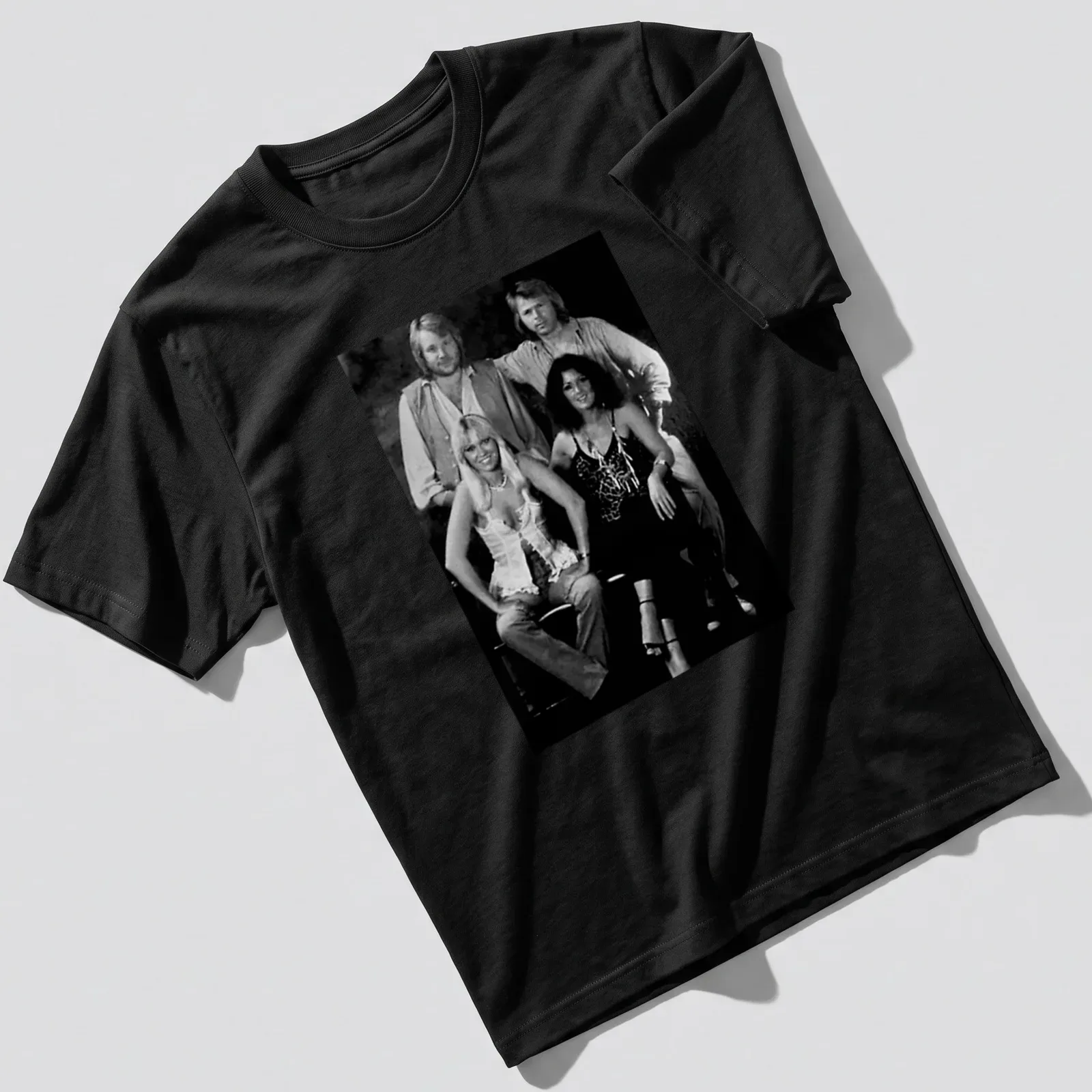 Vintage style T-shirt featuring ABBA pop group in black, white, and gray — printed on a unisex t-shirt