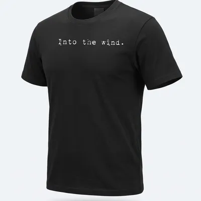 Minimalist white t-shirt with the text 'Into the wind.'