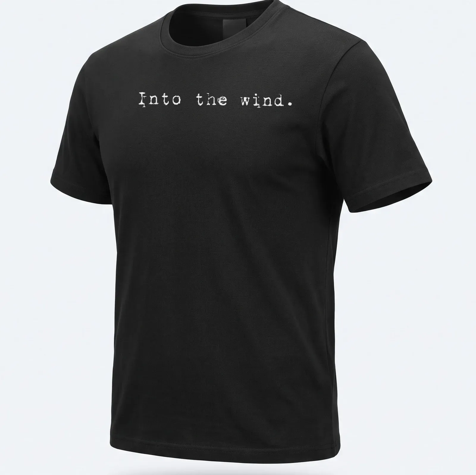 Minimalist white t-shirt with the text 'Into the wind.' — printed on a unisex t-shirt