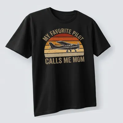 Retro distressed t-shirt with airplane graphic and text My Favorite Pilot Calls Me Mom — printed on a unisex t-shirt (angled view)