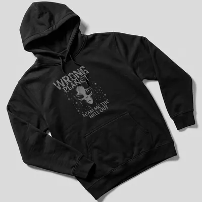 Vintage graphic featuring an alien with text about being on the wrong planet. — printed on a unisex hoodie