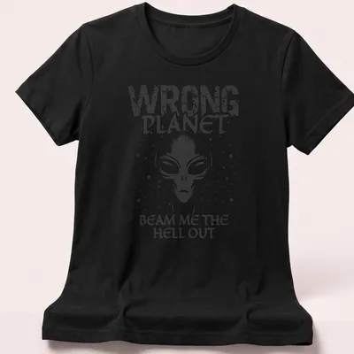 Vintage graphic featuring an alien with text about being on the wrong planet. — printed on a women's shirt