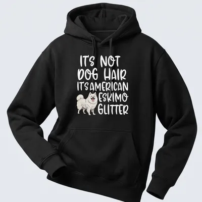 Illustrative t-shirt with an American Eskimo Dog and the text: It's Not Dog Hair It's American Eskimo Glitter — printed on a unisex hoodie