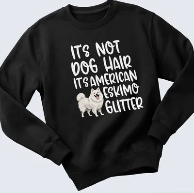 Illustrative t-shirt with an American Eskimo Dog and the text: It's Not Dog Hair It's American Eskimo Glitter — printed on a unisex sweatshirt