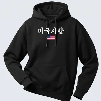 American Flag T-shirt featuring clean modern design with printed text '미국사람' — printed on a unisex hoodie