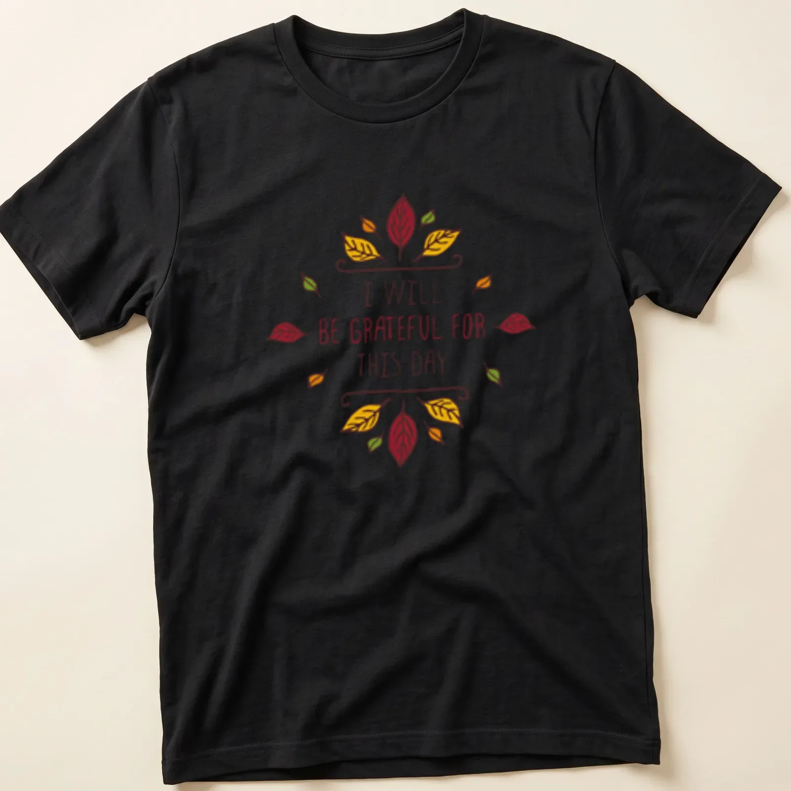Whimsical autumn leaves with the text 'I WILL BE GRATEFUL FOR THIS DAY' — printed on a unisex t-shirt