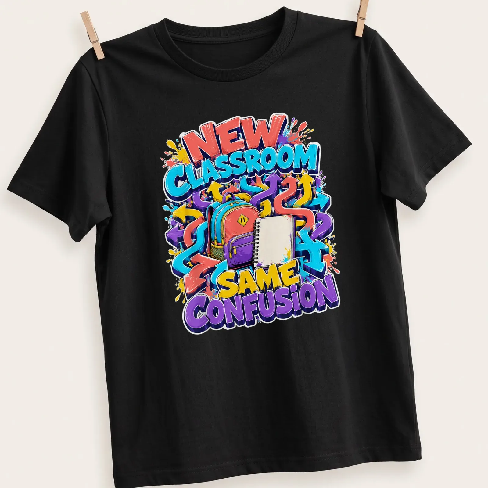 Colorful graffiti t-shirt featuring a backpack and notebook with the text NEW CLASSROOM SAME CONFUSION — printed on a unisex t-shirt