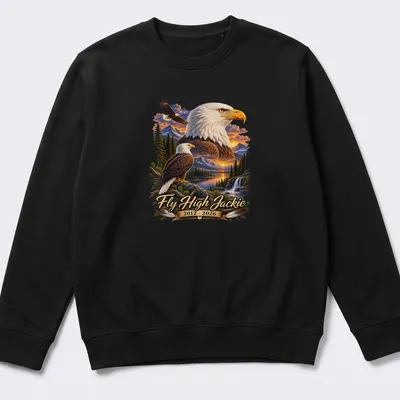 Realistic print of a Bald Eagle with text honoring Jackie 2012-2026 — printed on a unisex sweatshirt
