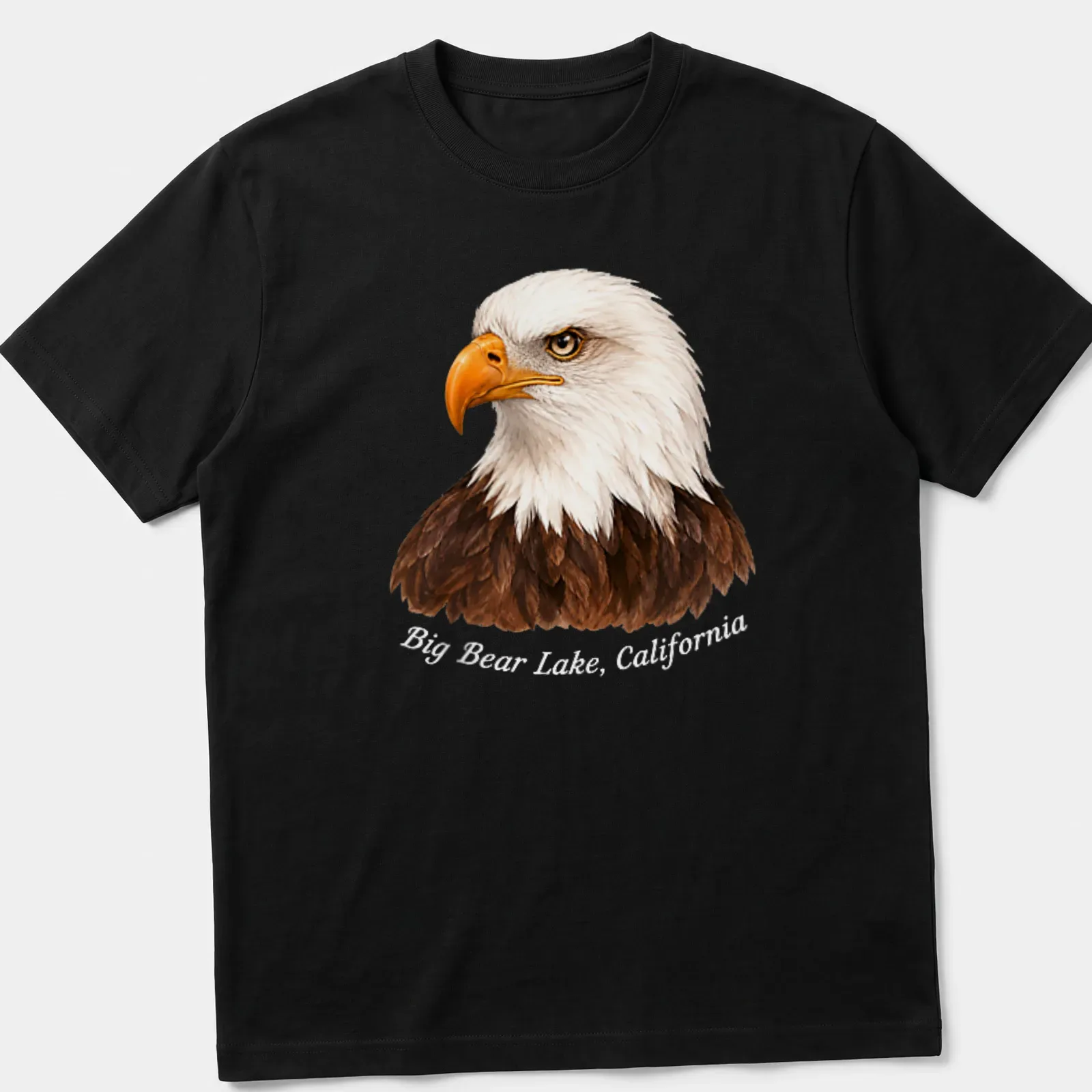 Realistic print of a Bald Eagle flying with text about Big Bear Lake, California — printed on a unisex t-shirt