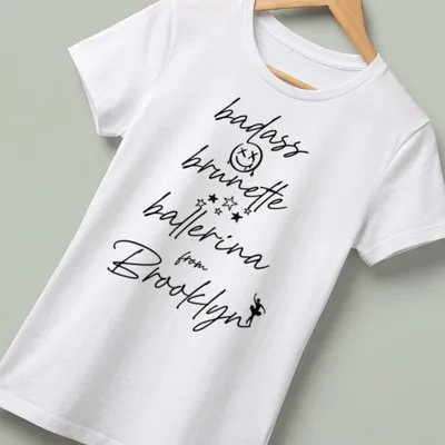 Modern script design of a badass brunette ballerina from Brooklyn — printed on a women's shirt