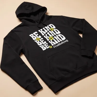 Bold typography t-shirt featuring yellow flowers and the phrase Be Kind #EndBullying — printed on a unisex hoodie