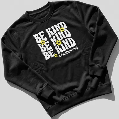 Bold typography t-shirt featuring yellow flowers and the phrase Be Kind #EndBullying — printed on a unisex sweatshirt