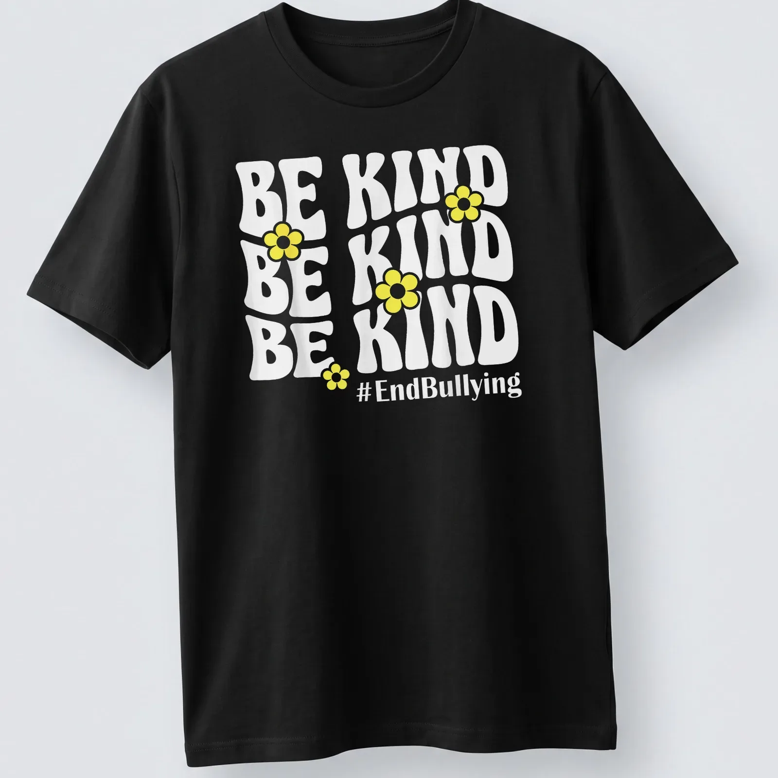 Bold typography t-shirt featuring yellow flowers and the phrase Be Kind #EndBullying — printed on a unisex t-shirt