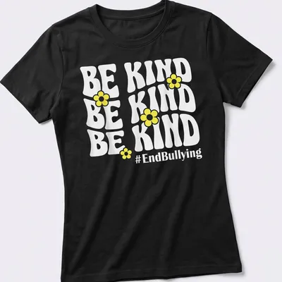 Bold typography t-shirt featuring yellow flowers and the phrase Be Kind #EndBullying — printed on a women's shirt
