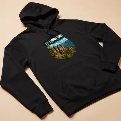 Vintage shield design featuring Blue Mountains National Park text with nature illustration. — printed on a unisex hoodie
