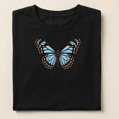 Realistic Blue Tiger Butterfly design in blue, black, and white on a — printed on a women's shirt