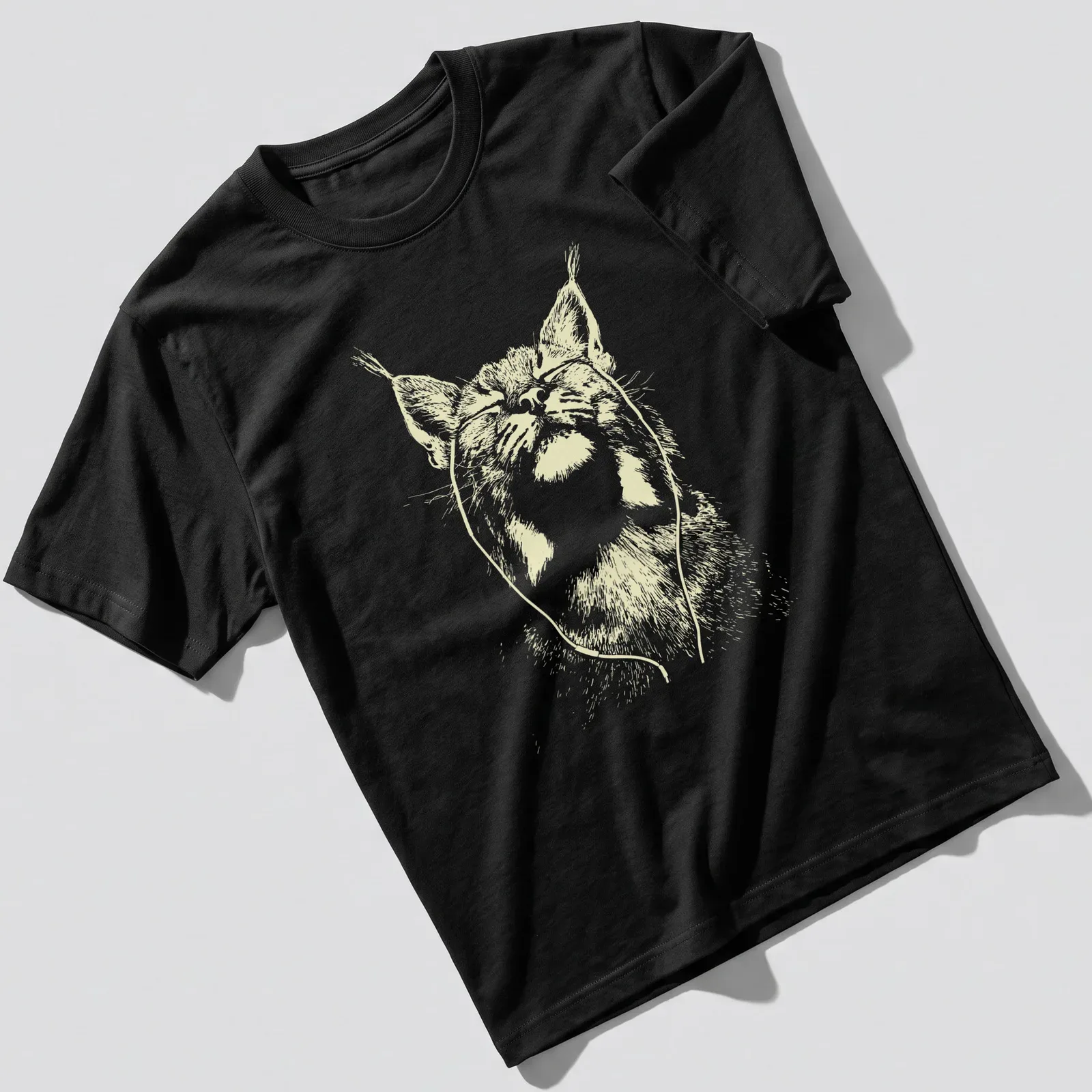 Minimalist line-art of a bobcat with earbuds in light yellow and white — printed on a unisex t-shirt