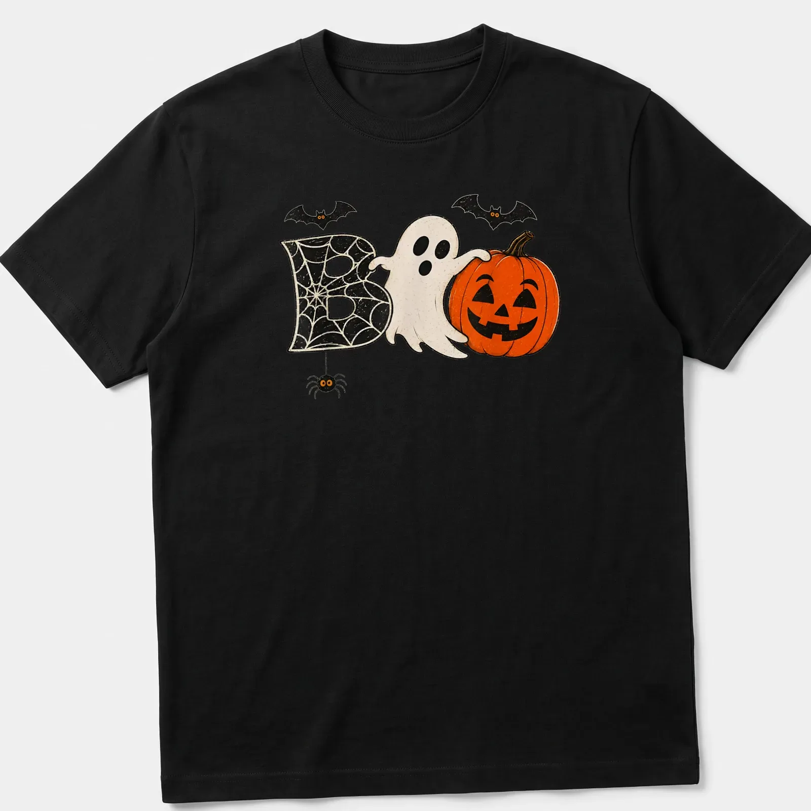 Retro distressed Halloween t-shirt featuring a ghost, pumpkin, and spider around the word 'Boo' — printed on a unisex t-shirt