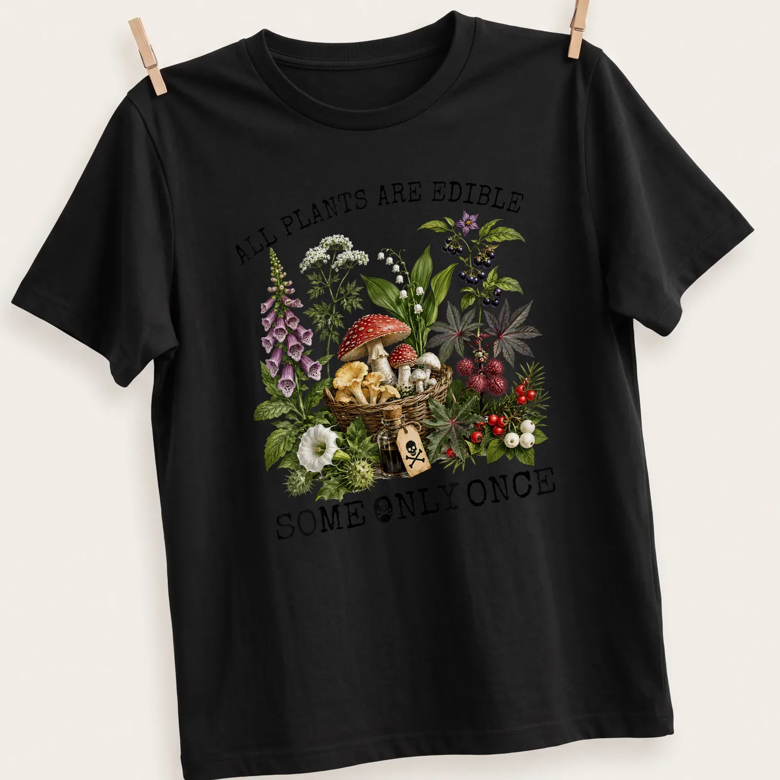 Vintage botanical illustration featuring various plants and mushrooms with text. — printed on a unisex t-shirt