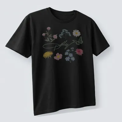 Charming pastel illustration of a butterfly and colorful flowers with Dolly signature — printed on a unisex t-shirt (angled view)