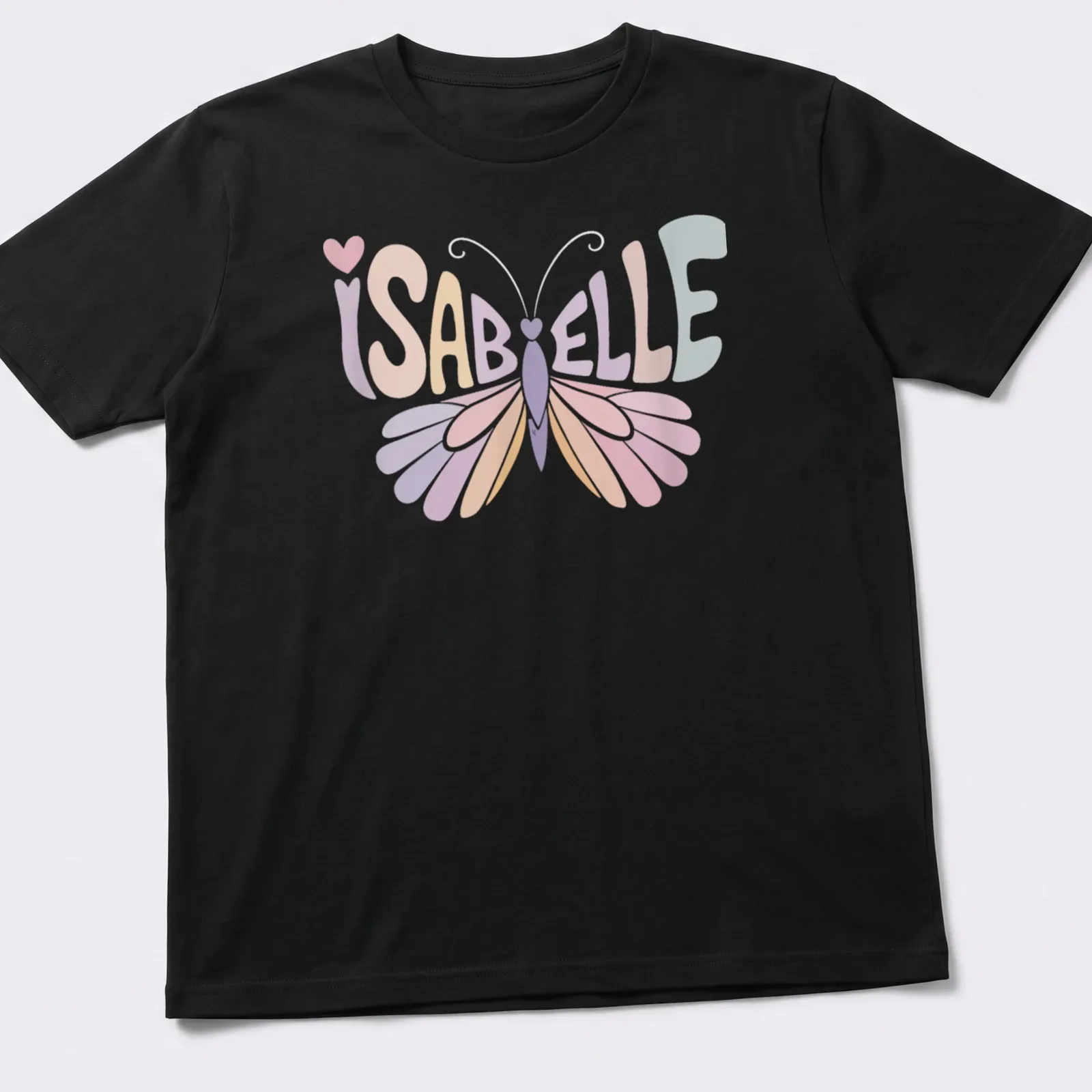 Vintage style t-shirt with the name Isabelle and a butterfly illustration in soft colors. — printed on a unisex t-shirt
