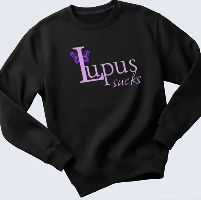 Illustration of a butterfly with the text 'Lupus sucks' in playful font. — printed on a unisex sweatshirt