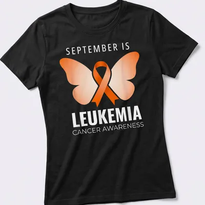 Butterfly graphic with text about leukemia cancer awareness in orange and white — printed on a women's shirt