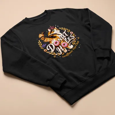 Colorful illustration of a calico cat with whimsical text about donut holes — printed on a unisex sweatshirt
