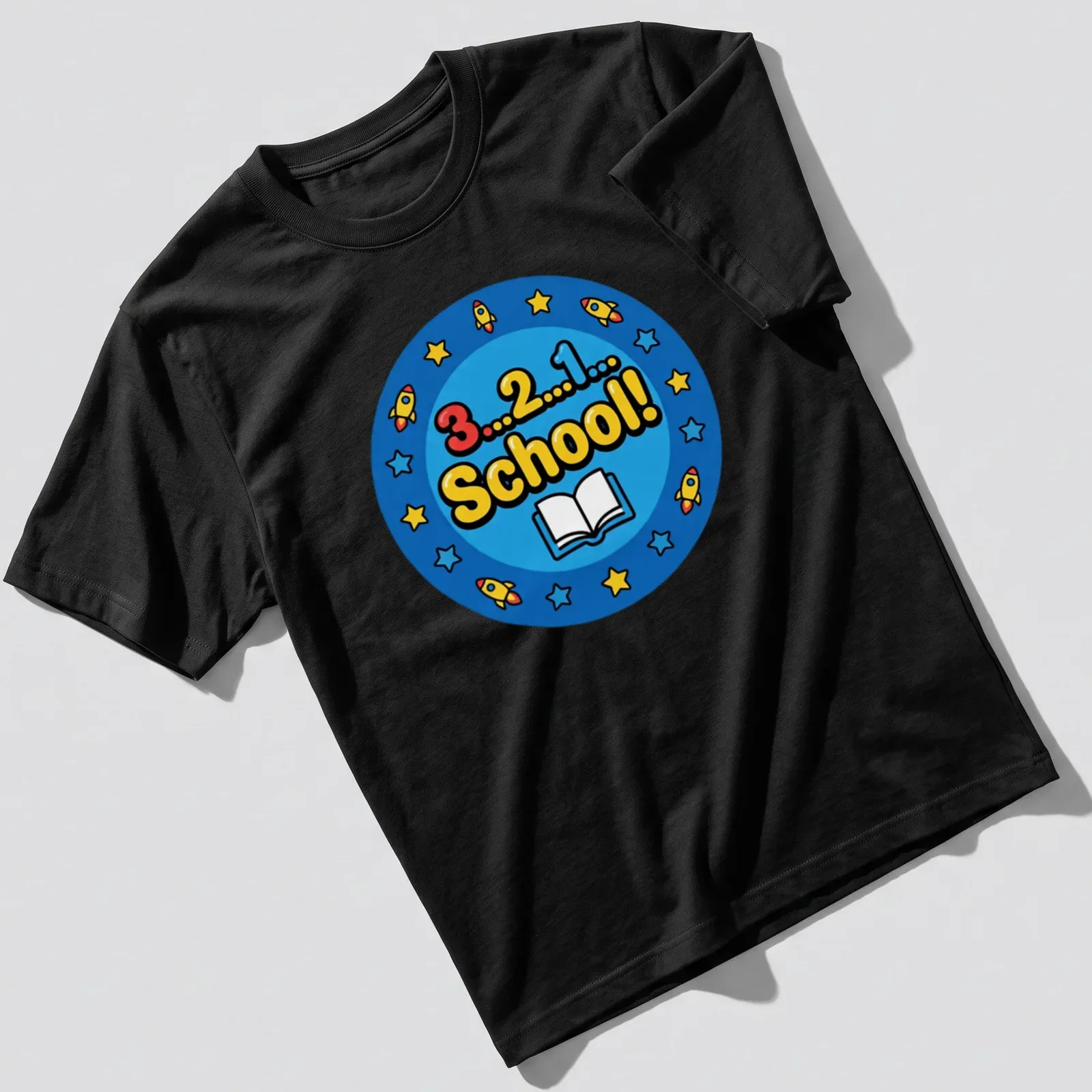 Colorful cartoon print of rockets and a book with the text 3...2...1... School! — printed on a unisex t-shirt