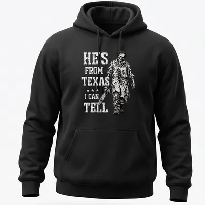 Chainsaw skeleton holding a chainsaw with text: He's From Texas I Can Tell. — printed on a unisex hoodie