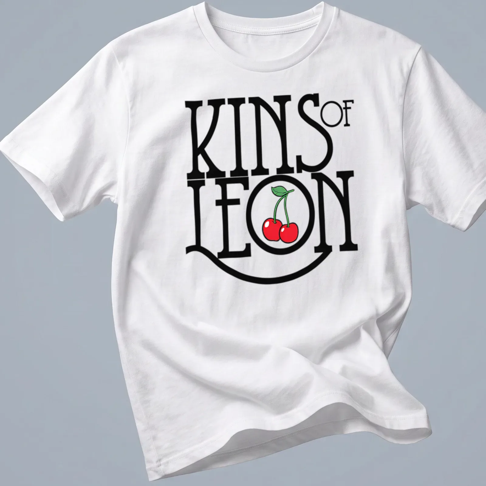Bold typography t-shirt featuring cherries with KINS of LEON text — printed on a unisex t-shirt