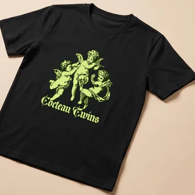 Vintage Cocteau Twins shirt featuring cherubic angels playing instruments