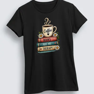 Whimsical illustration of a coffee cup atop a stack of colorful books with printed text — printed on a women's shirt