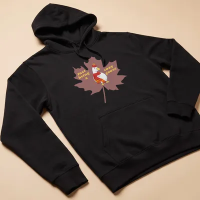 Cartoonish design of a cozy goose with playful text, warm colors — printed on a unisex hoodie