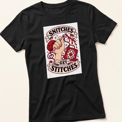 Colorful illustration with crochet yarn and hands, featuring 'SNITCHES GET STITCHES' text — printed on a women's shirt