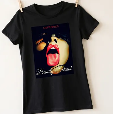 Vibrant art of a woman with red lips and tongue out, above Deftones Beauty School text — printed on a women's shirt