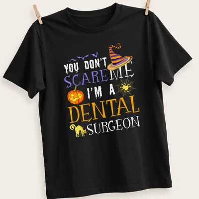 Whimsical Halloween shirt featuring a dental surgeon with playful text.