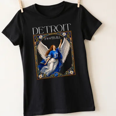 Ornate vintage print of an angel in a blue jersey with the number 97 above the word Detroit — printed on a women's shirt