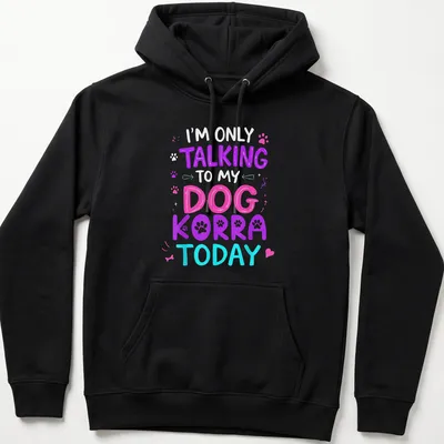 Colorful illustration of a dog named Korra with playful text above — printed on a unisex hoodie