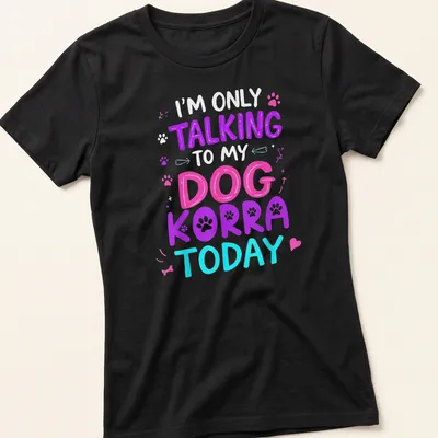 Colorful illustration of a dog named Korra with playful text above — printed on a women's shirt