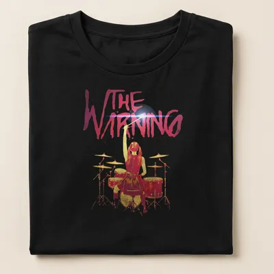 Watercolor print of a drummer girl with the text THE WARNING above her — printed on a women's shirt
