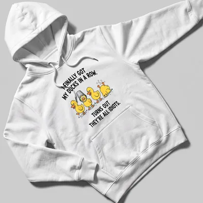 Cartoon design featuring yellow ducks with humorous text about organizing them. — printed on a unisex hoodie
