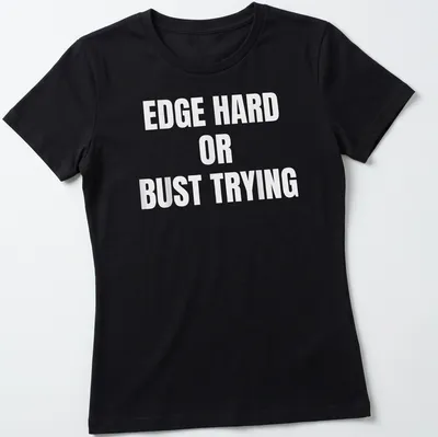 Bold typography t-shirt with the quote 'EDGE HARD OR BUST TRYING' on a white background — printed on a women's shirt