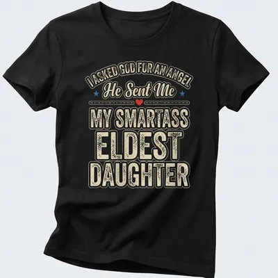 Playful typography t-shirt featuring humorous angel reference for eldest daughters — printed on a women's shirt