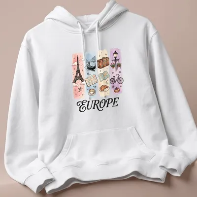 Illustrative watercolor design featuring Eiffel Tower, coffee, and croissant with 'EUROPE' text. — printed on a unisex hoodie