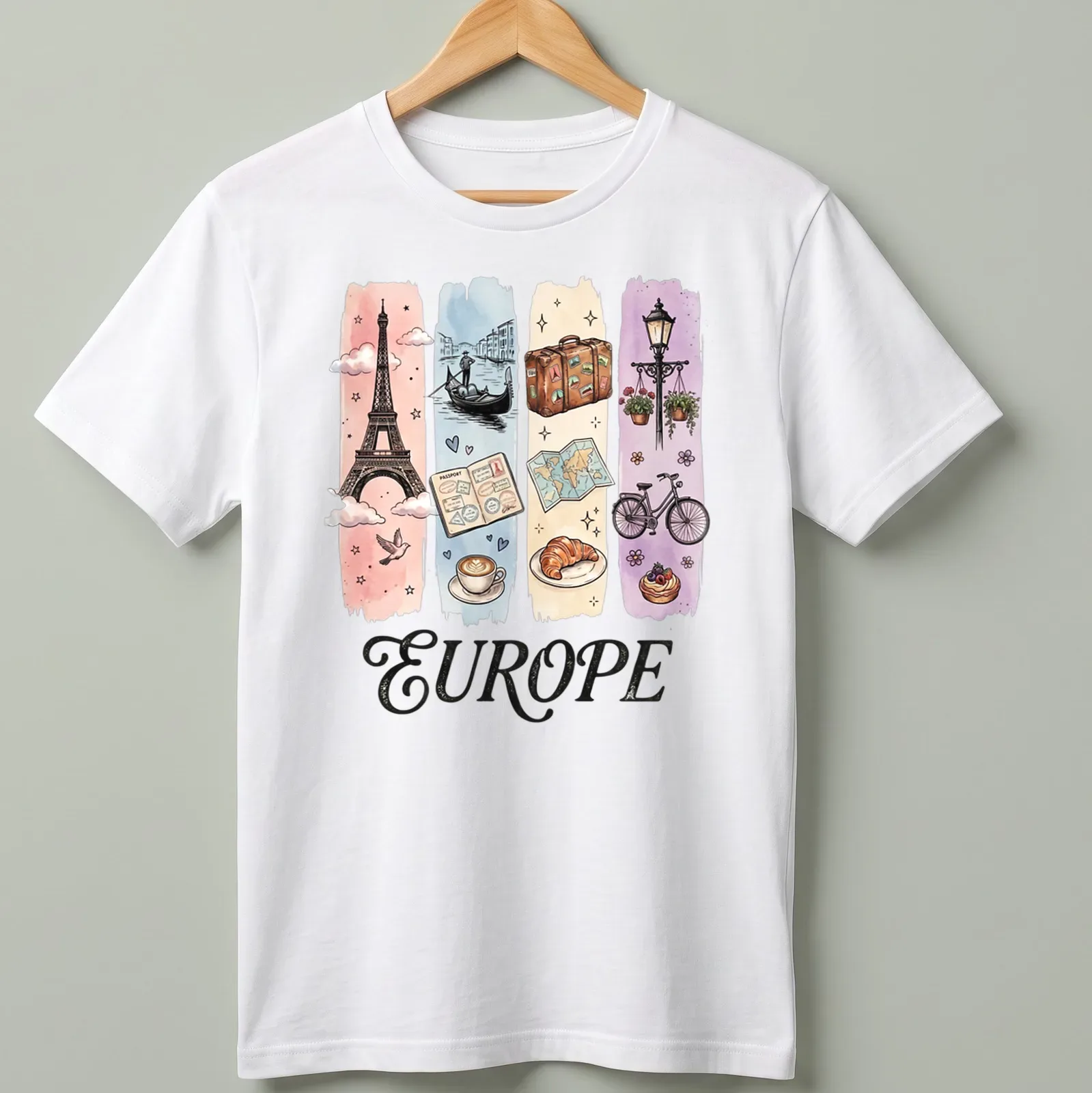 Illustrative watercolor design featuring Eiffel Tower, coffee, and croissant with 'EUROPE' text. — printed on a unisex t-shirt