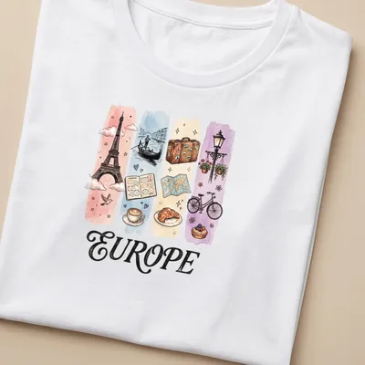Illustrative watercolor design featuring Eiffel Tower, coffee, and croissant with 'EUROPE' text. — printed on a women's shirt