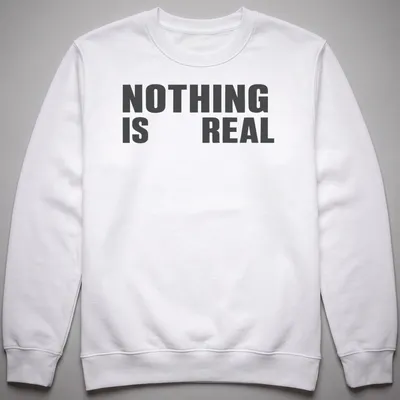 Minimalist typography t-shirt with black and white design stating 'NOTHING IS REAL' — printed on a unisex sweatshirt
