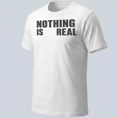 Minimalist typography t-shirt with black and white design stating 'NOTHING IS REAL'
